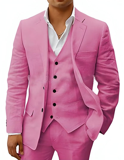 Model wearing the suit in a soft rose pink, showing the notch lapel jacket, vest and matching trousers. 14