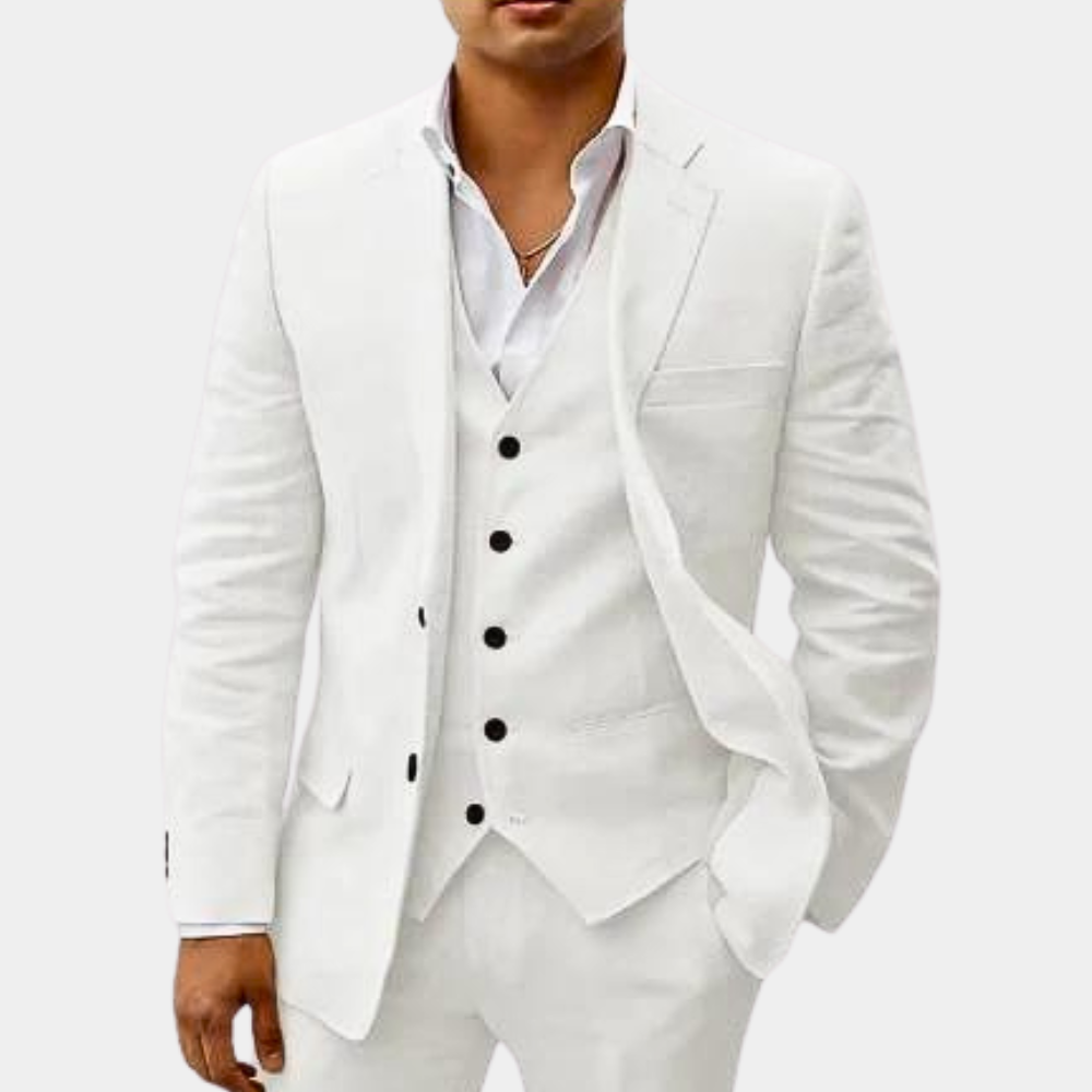 Model wearing the suit in white, with black buttons standing out against the vest and a white open-collar shirt. 5