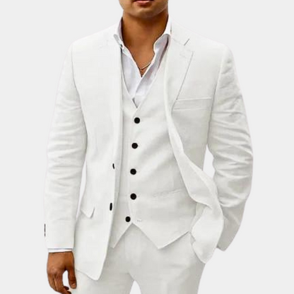Model wearing the suit in white, with black buttons standing out against the vest and a white open-collar shirt. 5