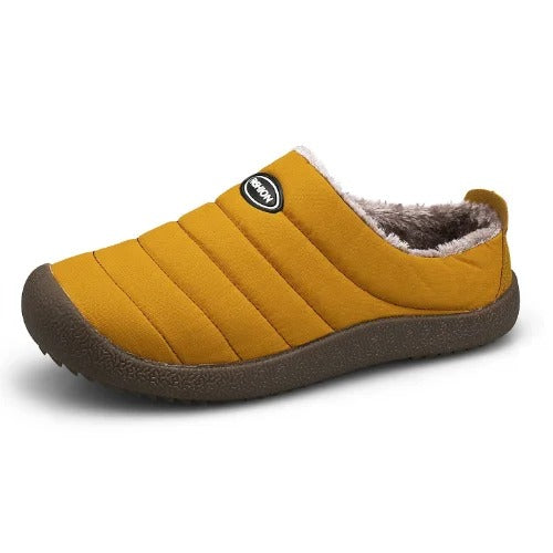 Single mustard yellow quilted slipper with fleece lining and dark brown sole on white background 13