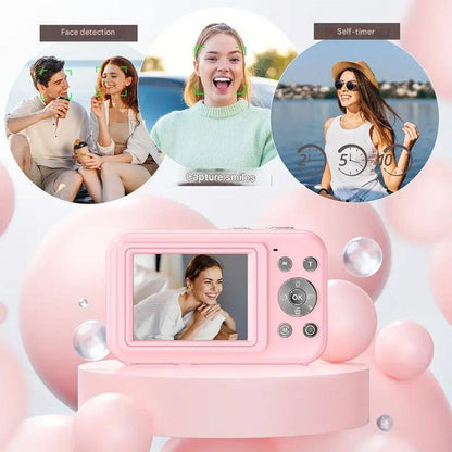 Pink camera on a pink stand showing its screen, with circles of face detection and self-timer examples 6