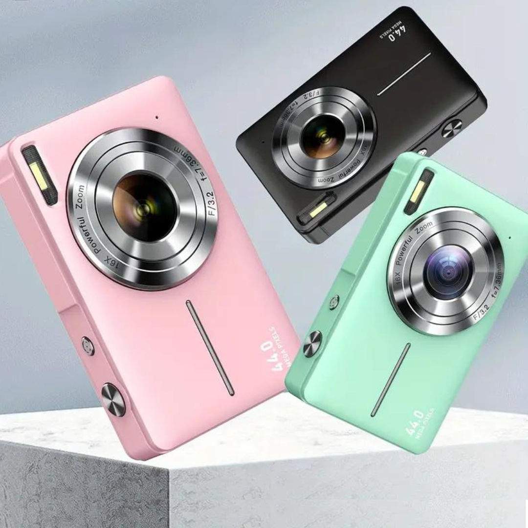 Pink, black and mint green cameras tilted at angles above a pale stone block, showing lenses and flashes 2