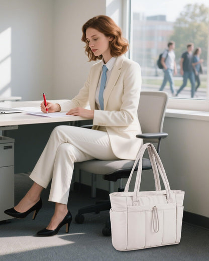 Padded puffer tote with cup holder and laptop compartment for travel and work