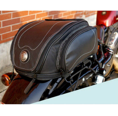 Waterproof motorbike tail bag with a fold-out storage compartment.