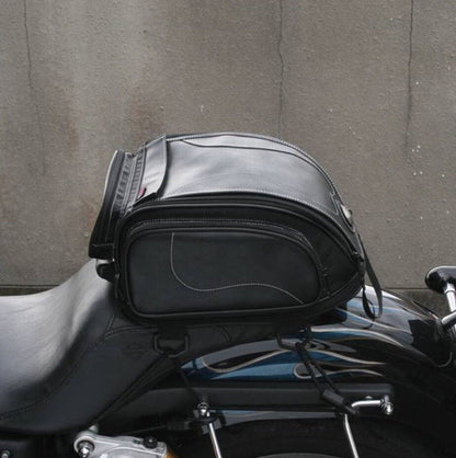 Waterproof motorbike tail bag with a fold-out storage compartment.