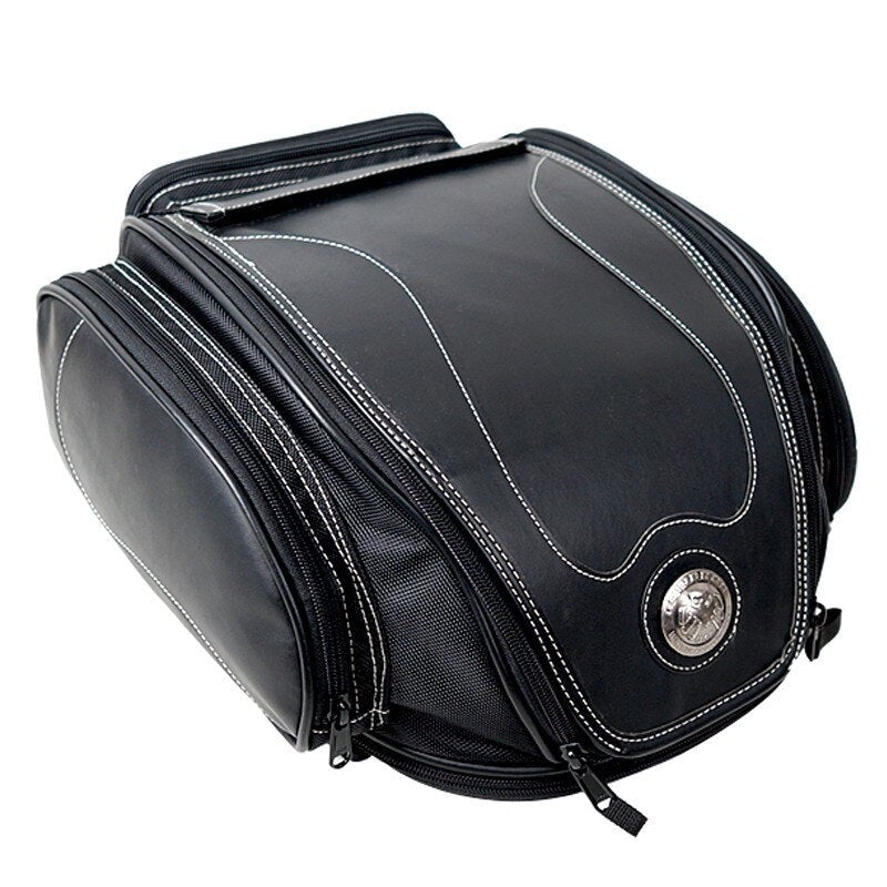 Waterproof motorbike tail bag with a fold-out storage compartment.