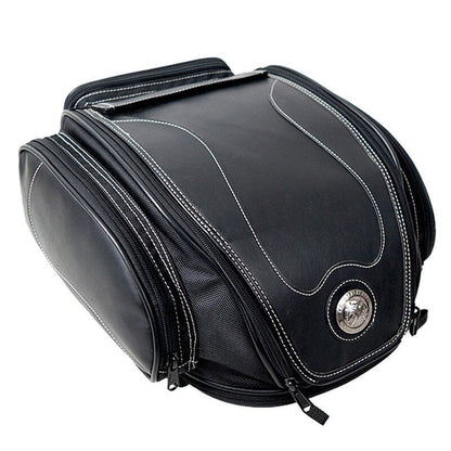 Waterproof motorbike tail bag with a fold-out storage compartment.