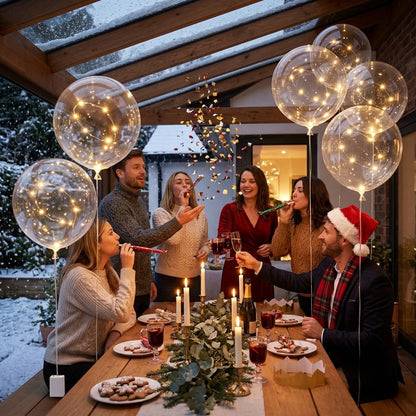 Friends toasting with party blowers at a winter table under glowing clear balloons 2