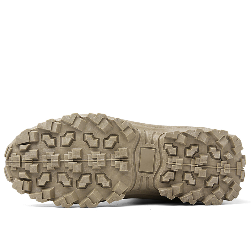 Close view of a sand-coloured outsole with a deep, blocky lug pattern 13