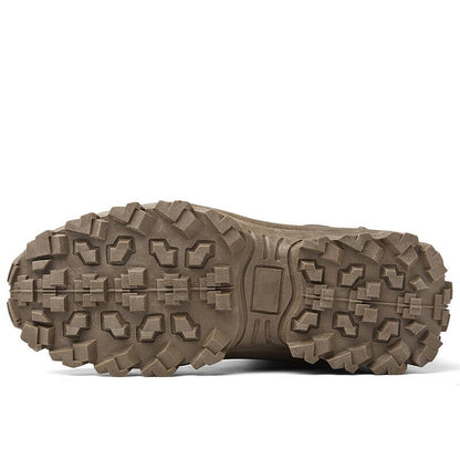 Underside of a brown boot showing the blocky, deep-lugged tread pattern of the outsole 18