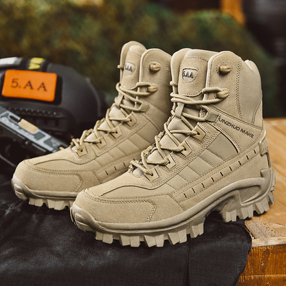 Sand-coloured pair of lace-up boots displayed on dark fabric beside tactical gear on a wooden surface 8