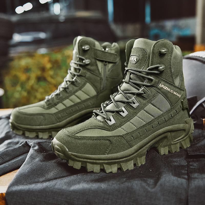 Pair of olive green high-top boots with zip and strap, resting on dark folded clothing 7
