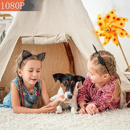 Two girls and a small dog lying on a fluffy rug in front of a teepee 2