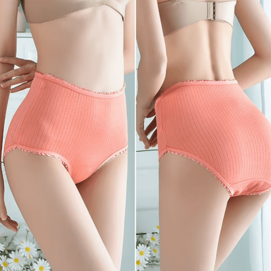 Side-by-side front and back views of a model wearing coral ribbed high-waisted briefs with frilled edges, daisies below. 3