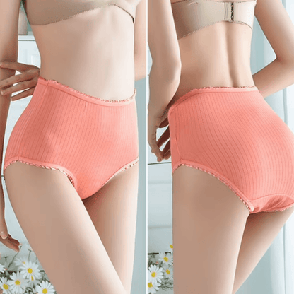 Side-by-side front and back views of a model wearing coral ribbed high-waisted briefs with frilled edges, daisies below. 3