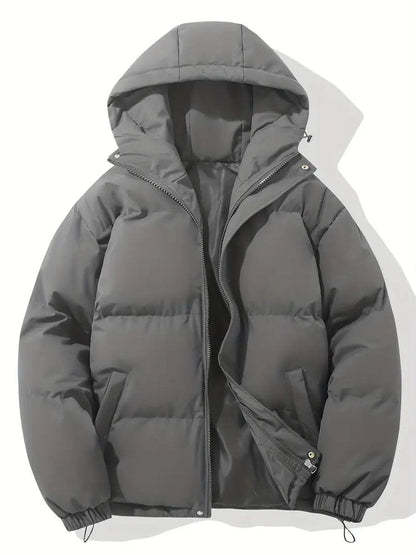 Charcoal grey hooded puffer jacket laid flat, zip partly open showing the dark lining 8