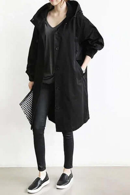 Black version worn with a dark v-neck top, skinny trousers, slip-on shoes and a patterned clutch 3