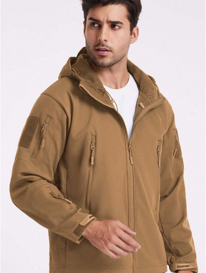Man in the tan hooded jacket worn open over a white t-shirt, showing the fleece-lined hood and collar. 17