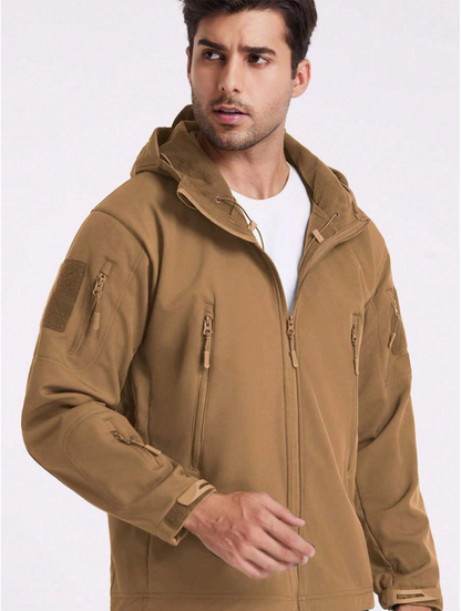 Man in the tan hooded jacket worn open over a white t-shirt, showing the fleece-lined hood and collar. 17