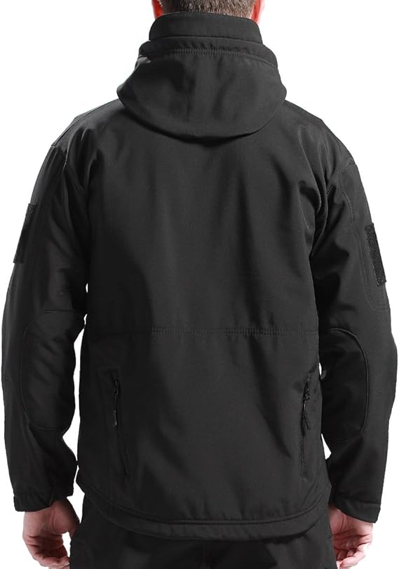 Back view of the black hooded jacket worn by a man, showing the stitched seam, lower zip pockets and elbow panels. 3