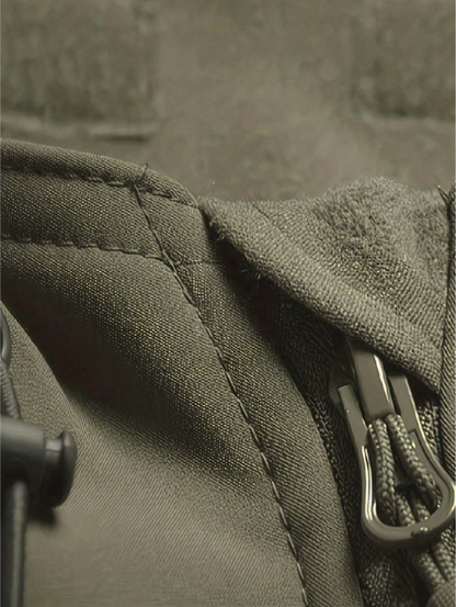 Close-up of the olive green fabric, stitched seams, fleece-lined hood edge, zip pull and drawcord toggle. 7